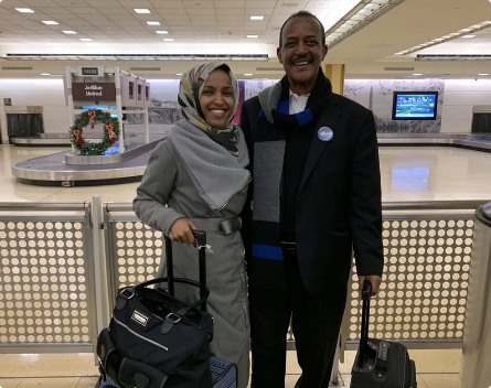 Ilhan smiling with family at airport